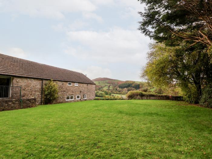 The Barn in Llanarmon-Yn-Ial, North Wales with indoor heated pool, valley view and woodburning stove