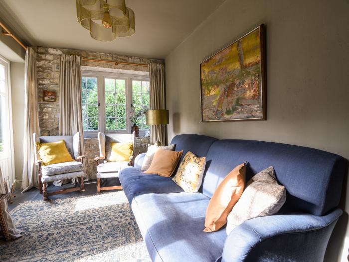 The Carriage House is in Uplyme, Dorset. Dog-friendly. Off-road parking. Smart TV. Woodburning stove