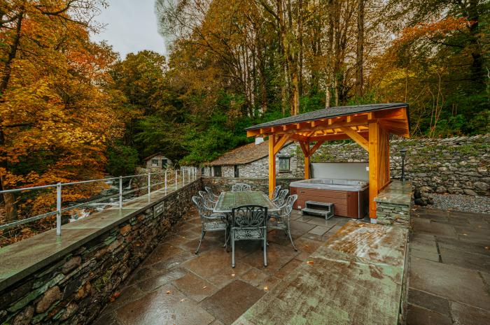 Gate House, is in Coniston, Cumbria. Four-bedroom home with stunning riverside views. Hot tub. Pets.