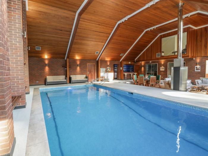 Branksome Wood House in Poole, Dorset. Close to amenities. Indoor swimming pool. Hot tub. Woodburner