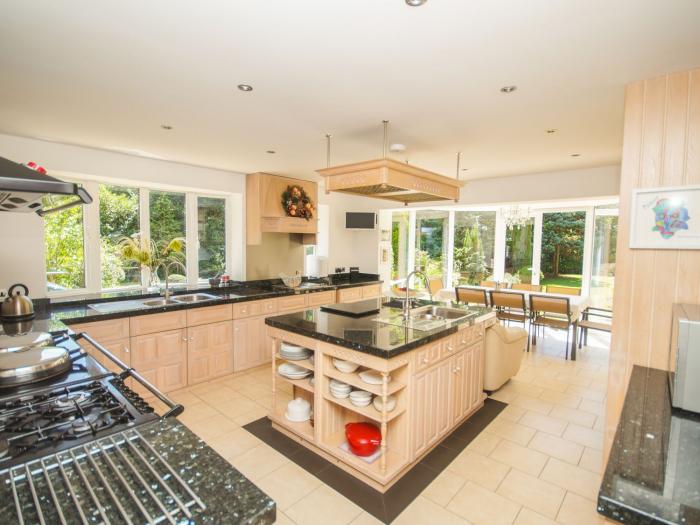 Branksome Wood House in Poole, Dorset. Close to amenities. Indoor swimming pool. Hot tub. Woodburner