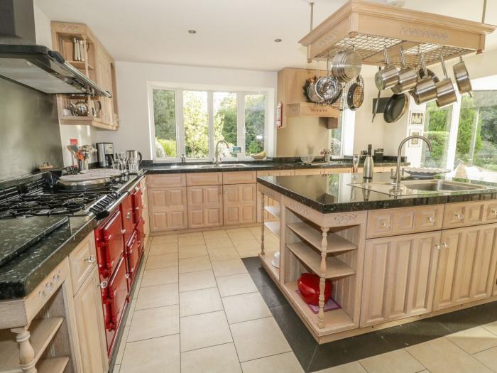 Branksome Wood House in Poole, Dorset. Close to amenities. Indoor swimming pool. Hot tub. Woodburner