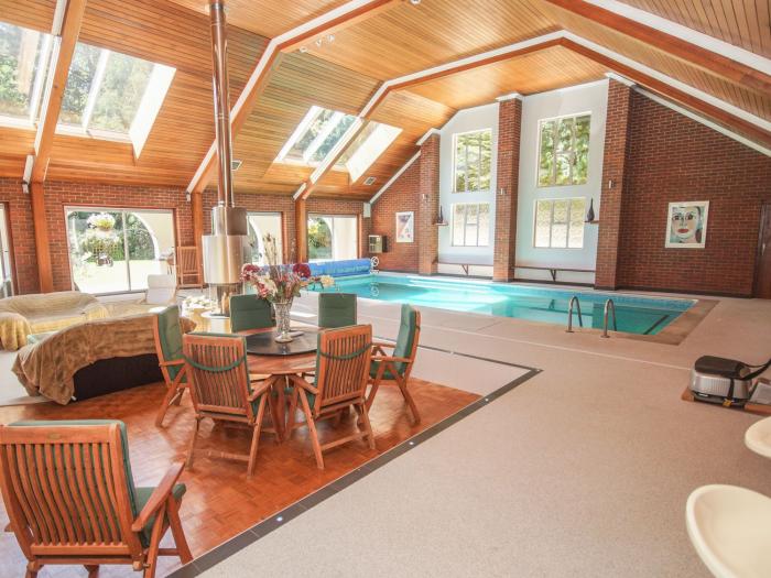 Branksome Wood House in Poole, Dorset. Close to amenities. Indoor swimming pool. Hot tub. Woodburner