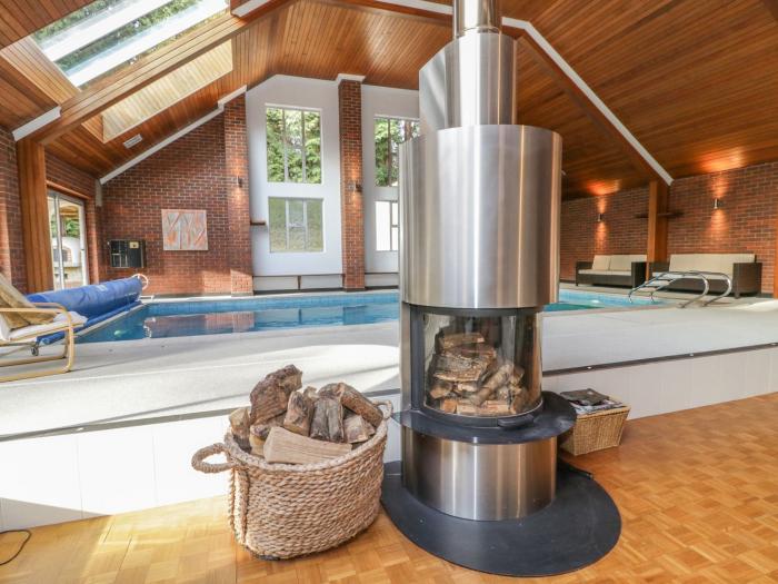 Branksome Wood House in Poole, Dorset. Close to amenities. Indoor swimming pool. Hot tub. Woodburner