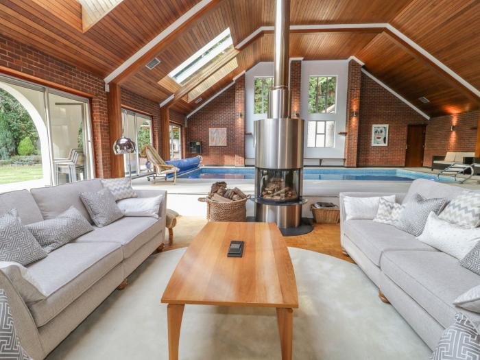 Branksome Wood House in Poole, Dorset. Close to amenities. Indoor swimming pool. Hot tub. Woodburner