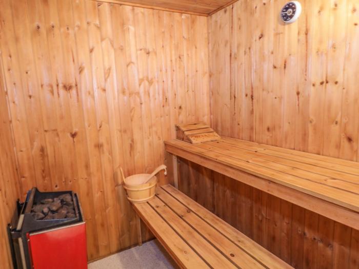 Branksome Wood House in Poole, Dorset. Close to amenities. Indoor swimming pool. Hot tub. Woodburner