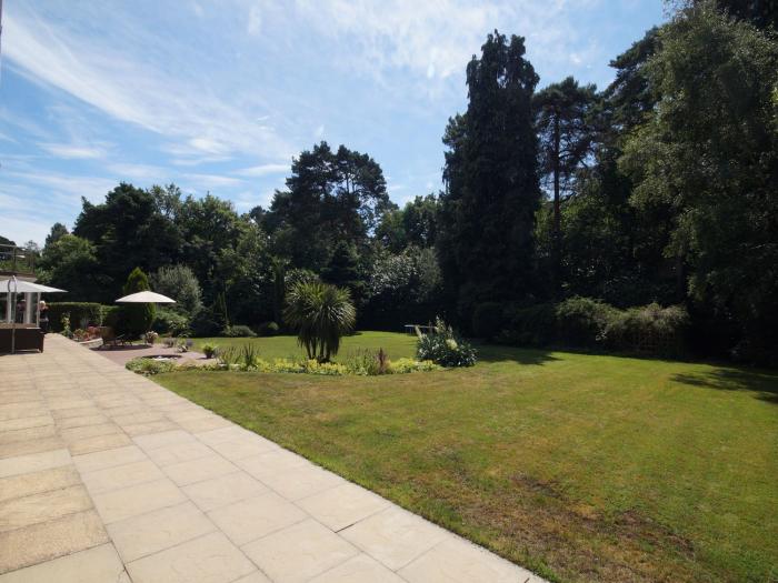 Branksome Wood House in Poole, Dorset. Close to amenities. Indoor swimming pool. Hot tub. Woodburner