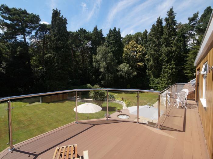 Branksome Wood House in Poole, Dorset. Close to amenities. Indoor swimming pool. Hot tub. Woodburner