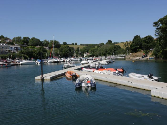 Penmarlam Quay Cottage is in Fowey, Cornwall. Close to amenities and a beach. Off-road parking. Dogs