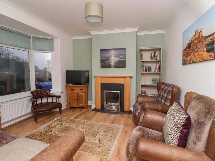 Maywood, in Seahouses, Northumberland. Close to amenities and a beach. Sea views. Woodburning stove.