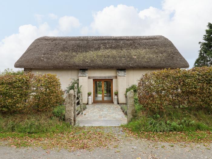 The Acorn Barn in Hittisleigh, Devon. Thatched cottage. Set in beautiful grounds. Romantic dwelling.