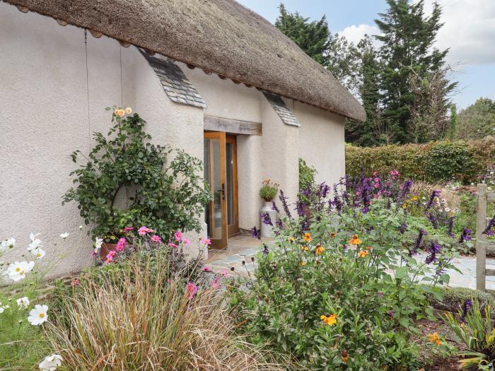 The Acorn Barn in Hittisleigh, Devon. Thatched cottage. Set in beautiful grounds. Romantic dwelling.