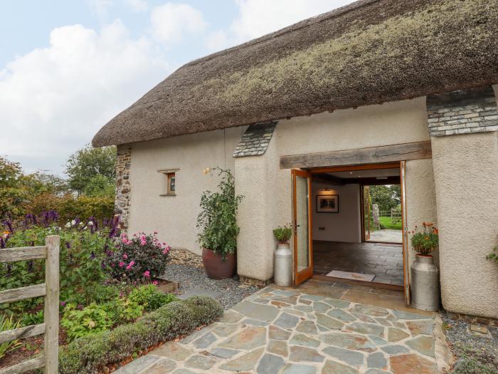 The Acorn Barn in Hittisleigh, Devon. Thatched cottage. Set in beautiful grounds. Romantic dwelling.