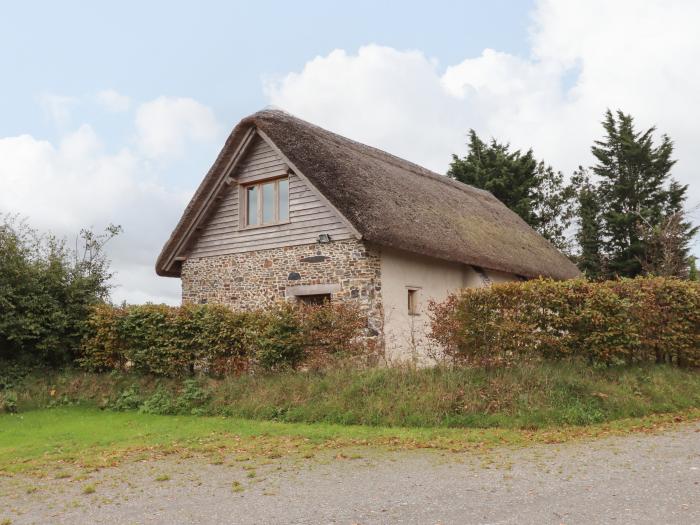 The Acorn Barn in Hittisleigh, Devon. Thatched cottage. Set in beautiful grounds. Romantic dwelling.