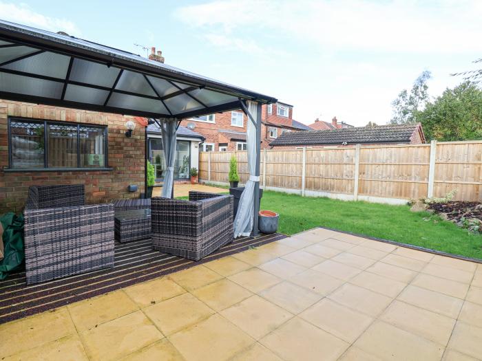 Rainbows End, in Christleton, Cheshire. Three-bedroom home near amenities. Stylish. Enclosed garden.