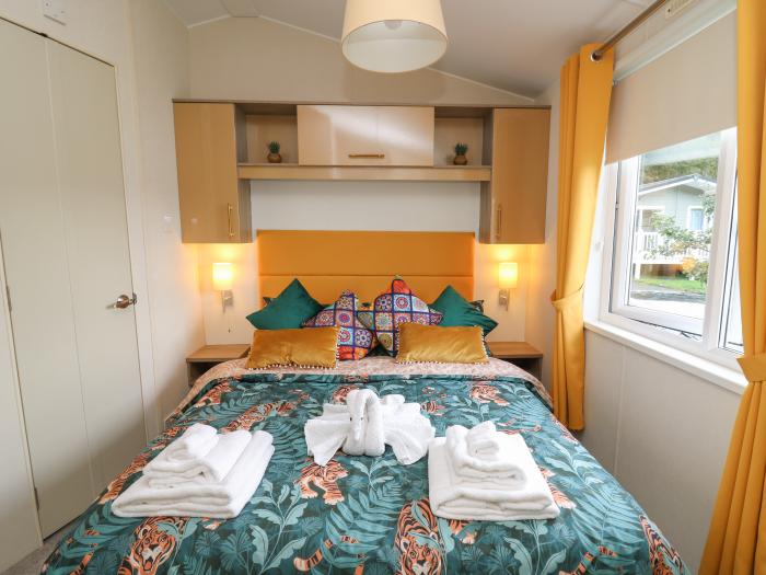 Hafan Taffy (Number 32), near Llanarth, Ceredigion. Pet-friendly lodge near the beach and amenities.