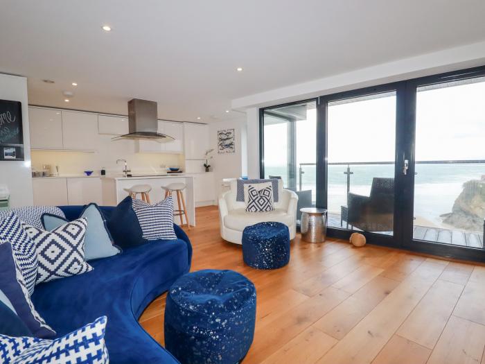 Towan Penthouse, is in Newquay, Cornwall. Third-floor apartment overlooking the coast. Contemporary.