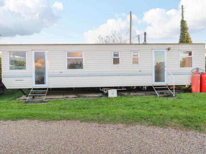 17 Beach Haven, Bacton, Norfolk. Detached lodge set on a small site with level, direct beach access.