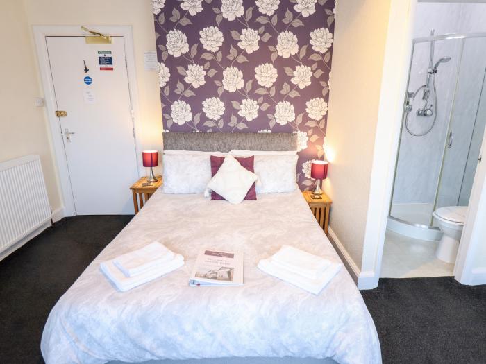 Caxton House, thirteen-bedroom holiday home in Skegness town centre, Lincolnshire. Off-road parking.