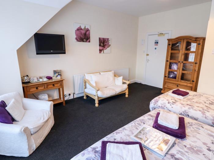 Caxton House, thirteen-bedroom holiday home in Skegness town centre, Lincolnshire. Off-road parking.