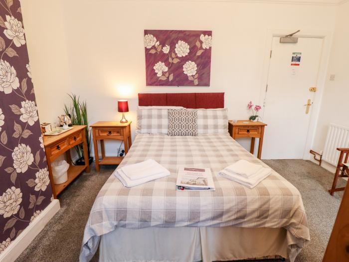 Caxton House, thirteen-bedroom holiday home in Skegness town centre, Lincolnshire. Off-road parking.