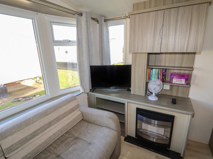 14 Fir Tree Close in Lyons Robin Hood Holiday Park near Rhyl, Denbighshire. A single-storey caravan.