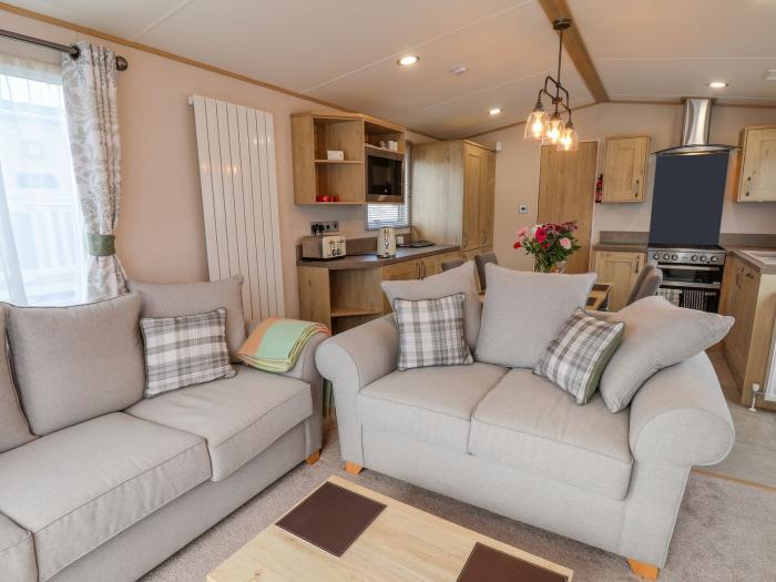 Heron 61. Single-storey lodge. Fritton nr Belton, Norfolk. Enclosed decking. Pet-friendly.